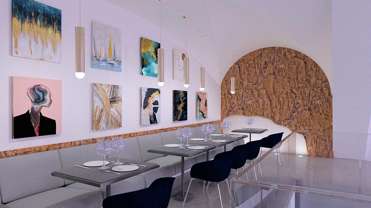 Una sala da pranzo con tavoli, sedie e quadri alle pareti.