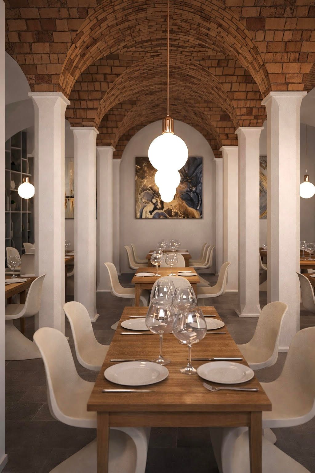 Una sala da pranzo con tavoli e sedie e un quadro sul muro.