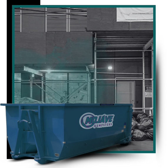 Commercial store with dumpster in front of it.