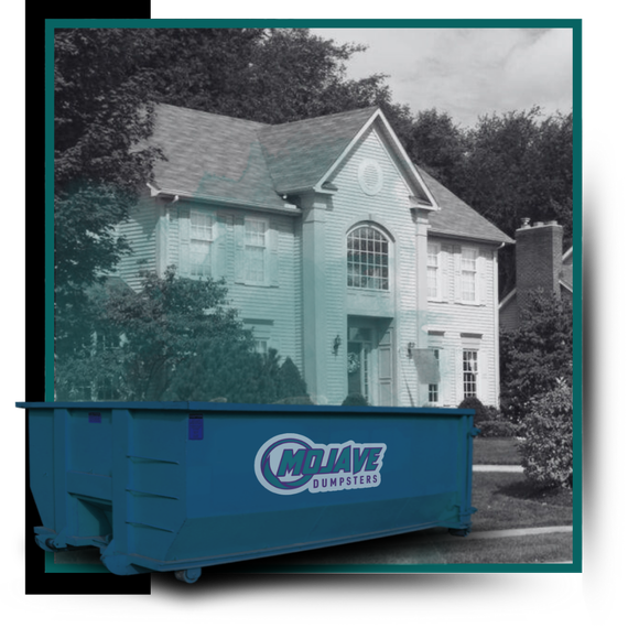 A dumpster in front of a house