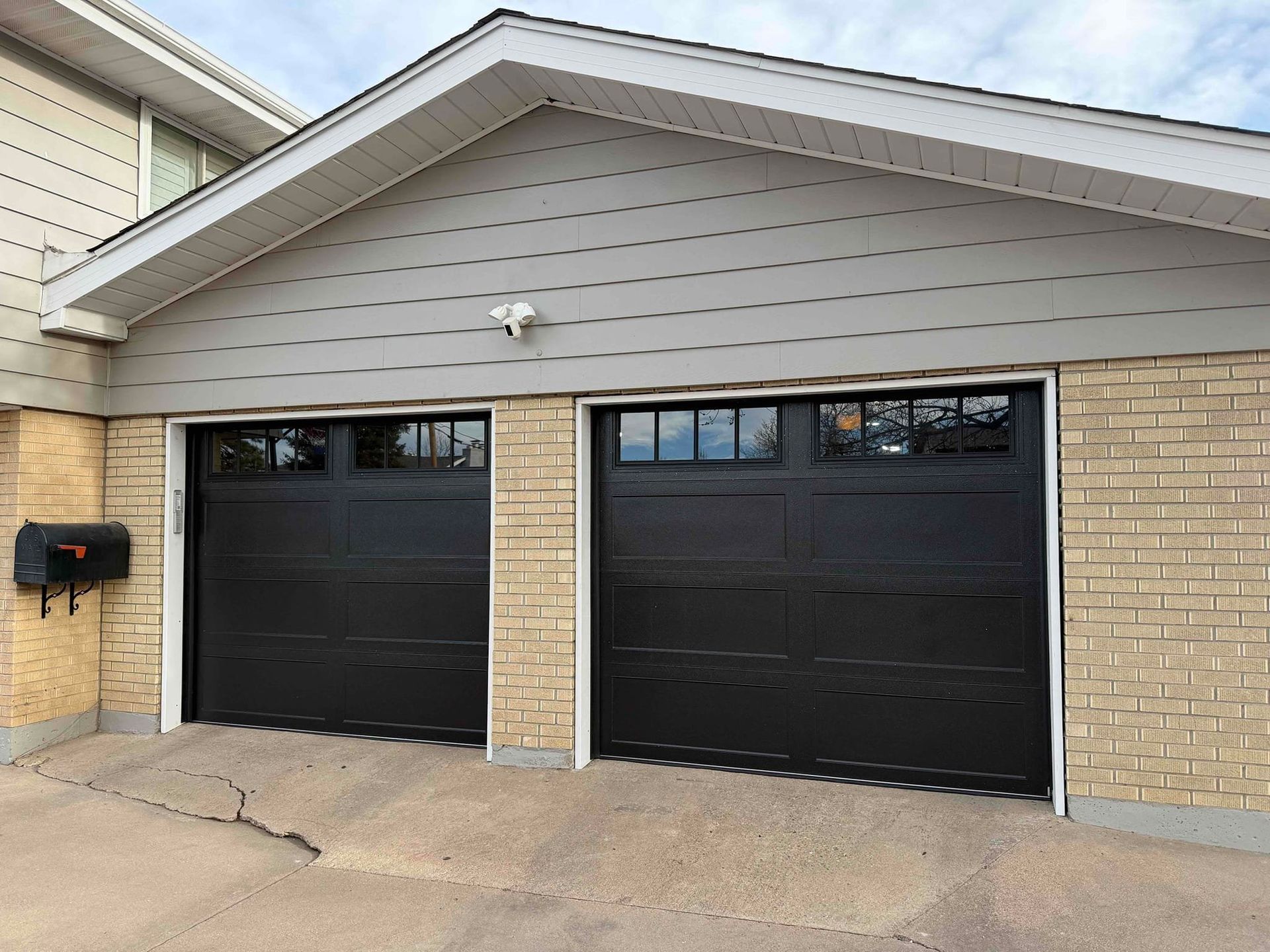 8x7 long recessed panel black garage doors with windows