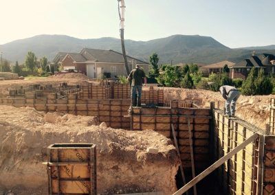 Solid — Workers Fixing the Foundation of the Wall in Equipment in Kanarraville, Utah