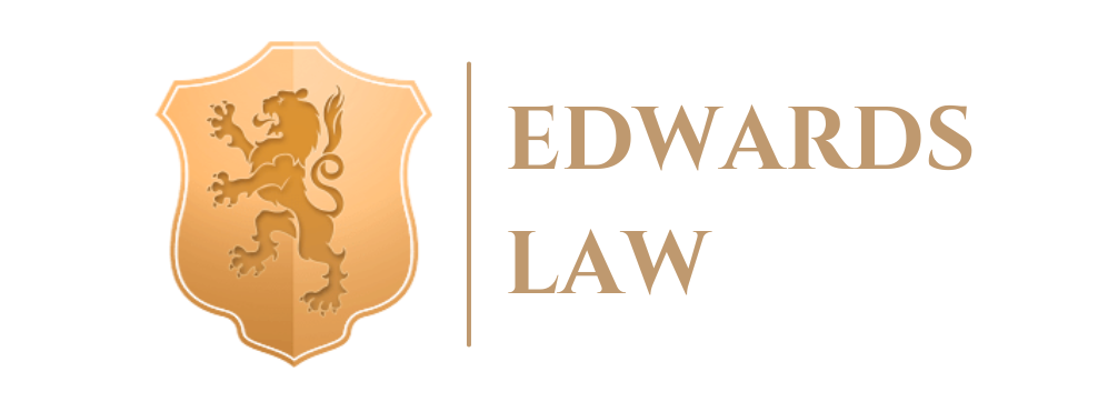 The logo for edwards law is a shield with a lion on it.