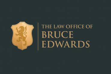 The logo for edwards law is a shield with a lion on it.