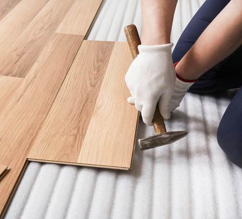 Man Installing a Wood Floor — DFW, TX — Platinum Service Group