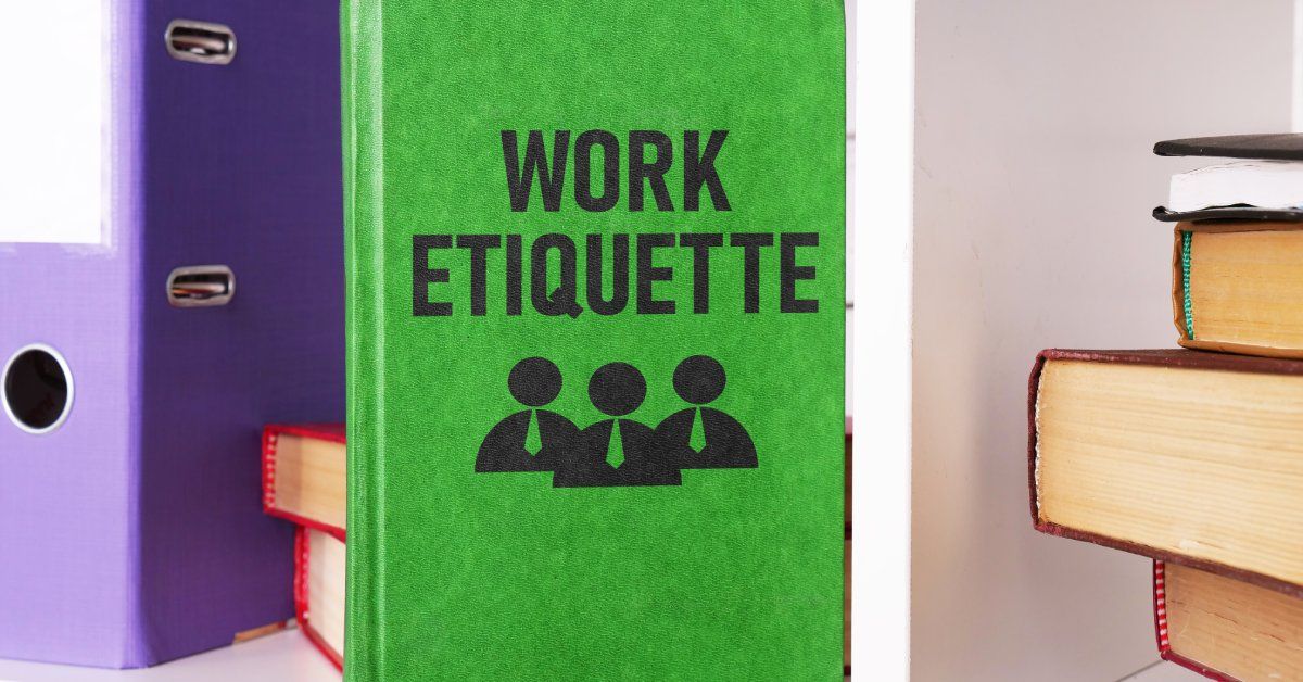 A green book with the words “work etiquette” on the front in black text. It sits with other books.