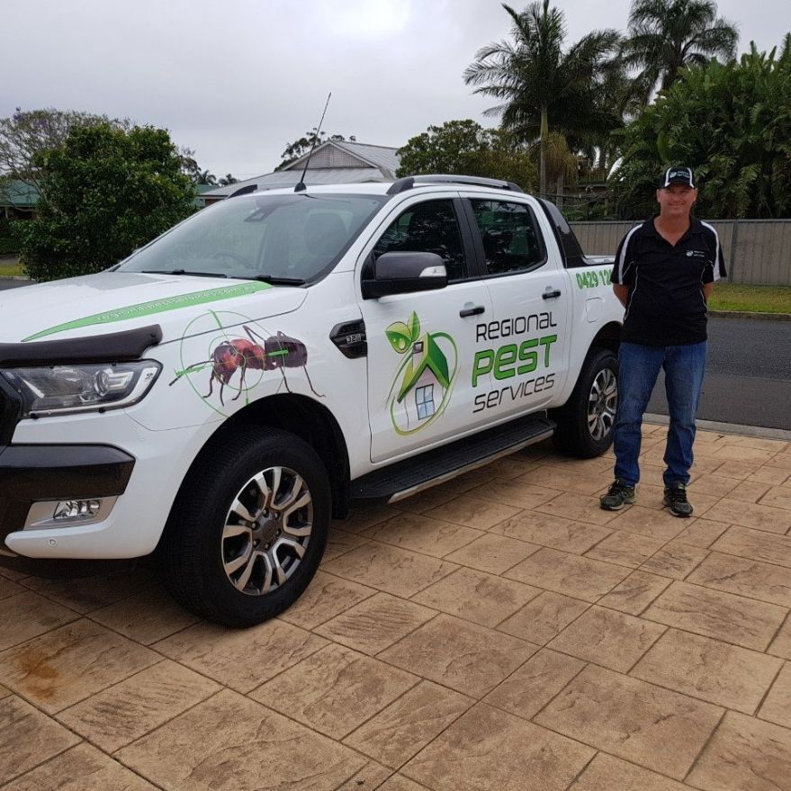 Man Standing Beside The Service Car — Pest Control in Sussex Inlet, NSW