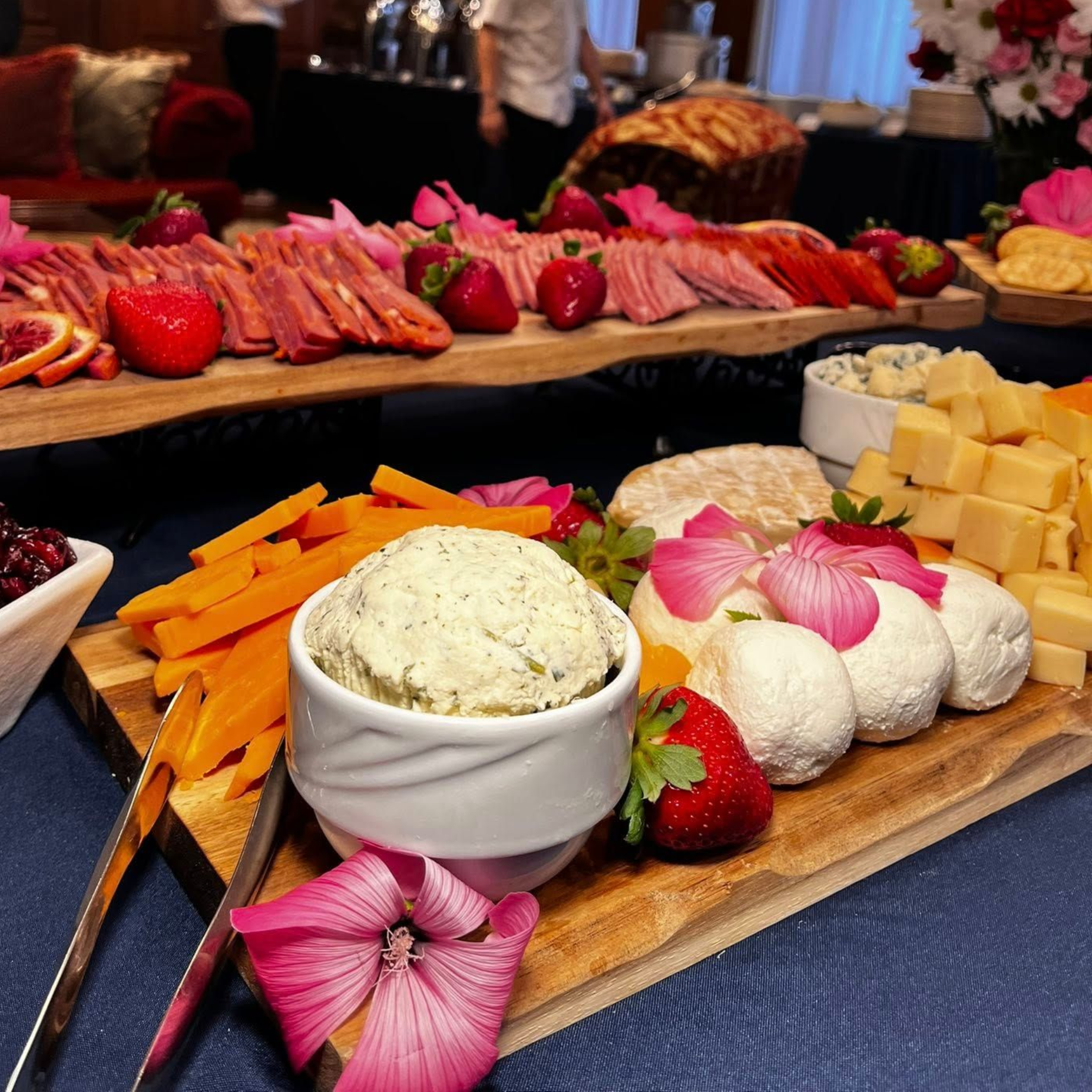 Catering image of a large cheese and fruit spread. 