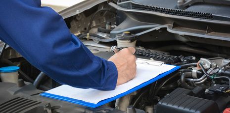 Worker maintaining the records of car servicing in Banbury, OX