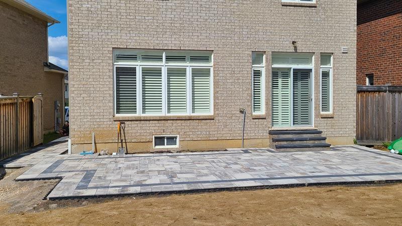 Completed natural stone and interlock patio project