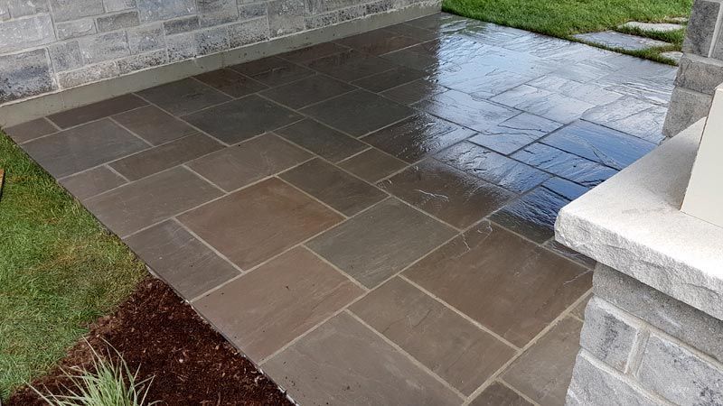 Completed natural stone and interlock patio project