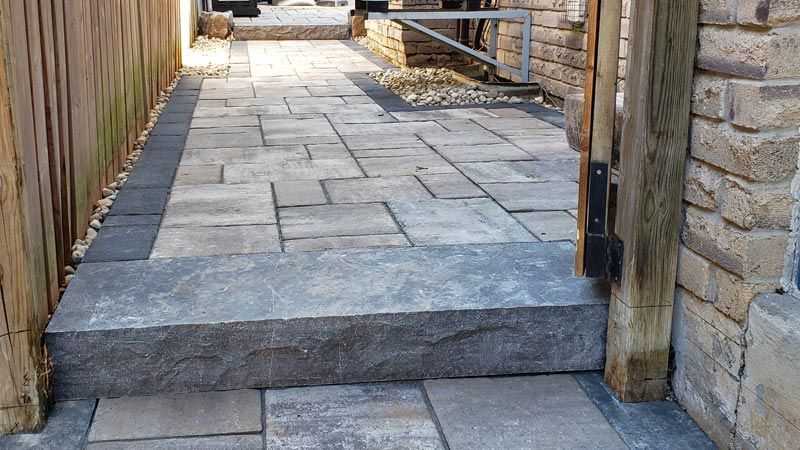 Completed natural stone and interlock walkway project