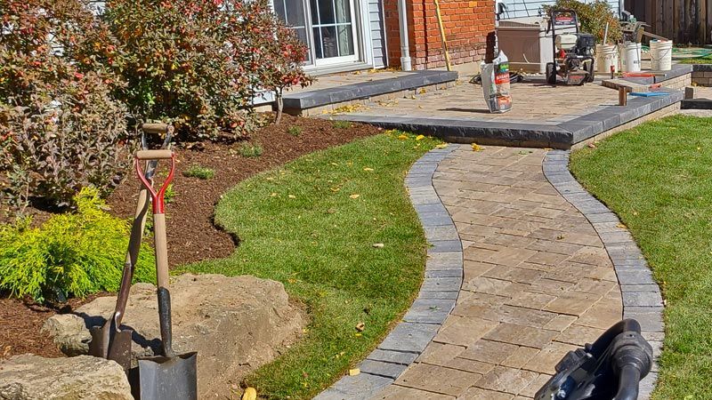 Completed natural stone and interlock walkway project