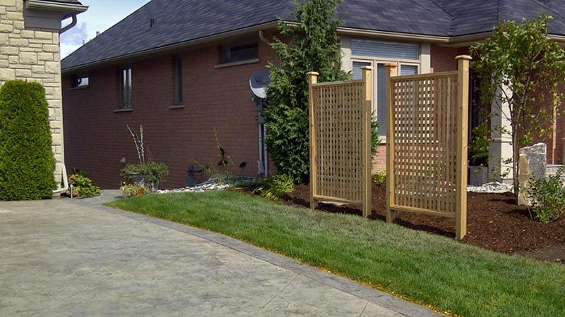 Completed natural stone, interlock, and wooden wall project