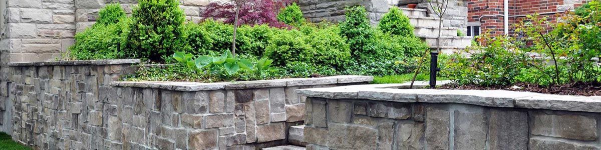 Natural stone wall and staircase landscape construction