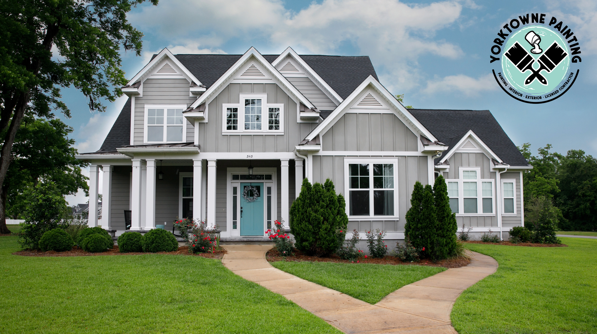 A large house is sitting on a lush green lawn in a residential neighborhood.