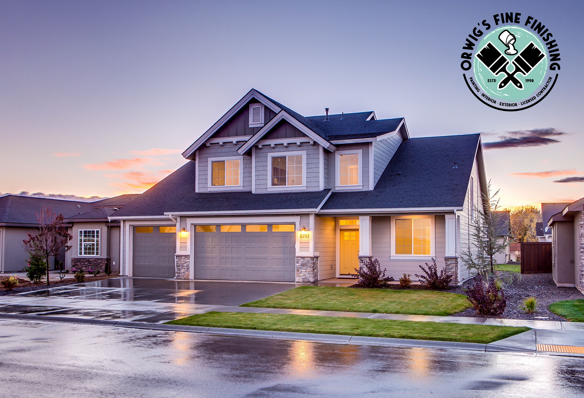 A large house is sitting on a lush green lawn in a residential neighborhood.