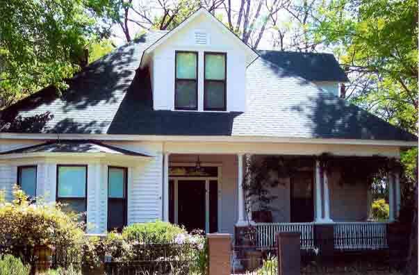 Front View of House with Black Roof — Decatur, AL — Guaranty Roofing