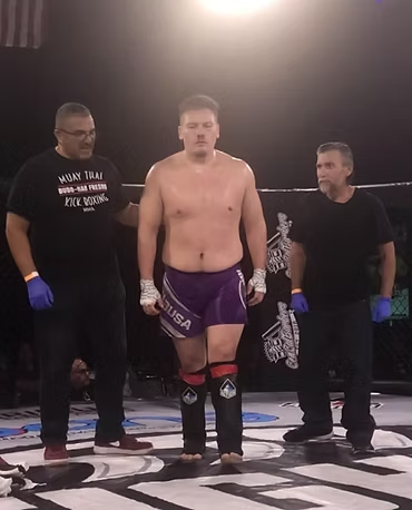 A man wearing a shirt that says wow tru