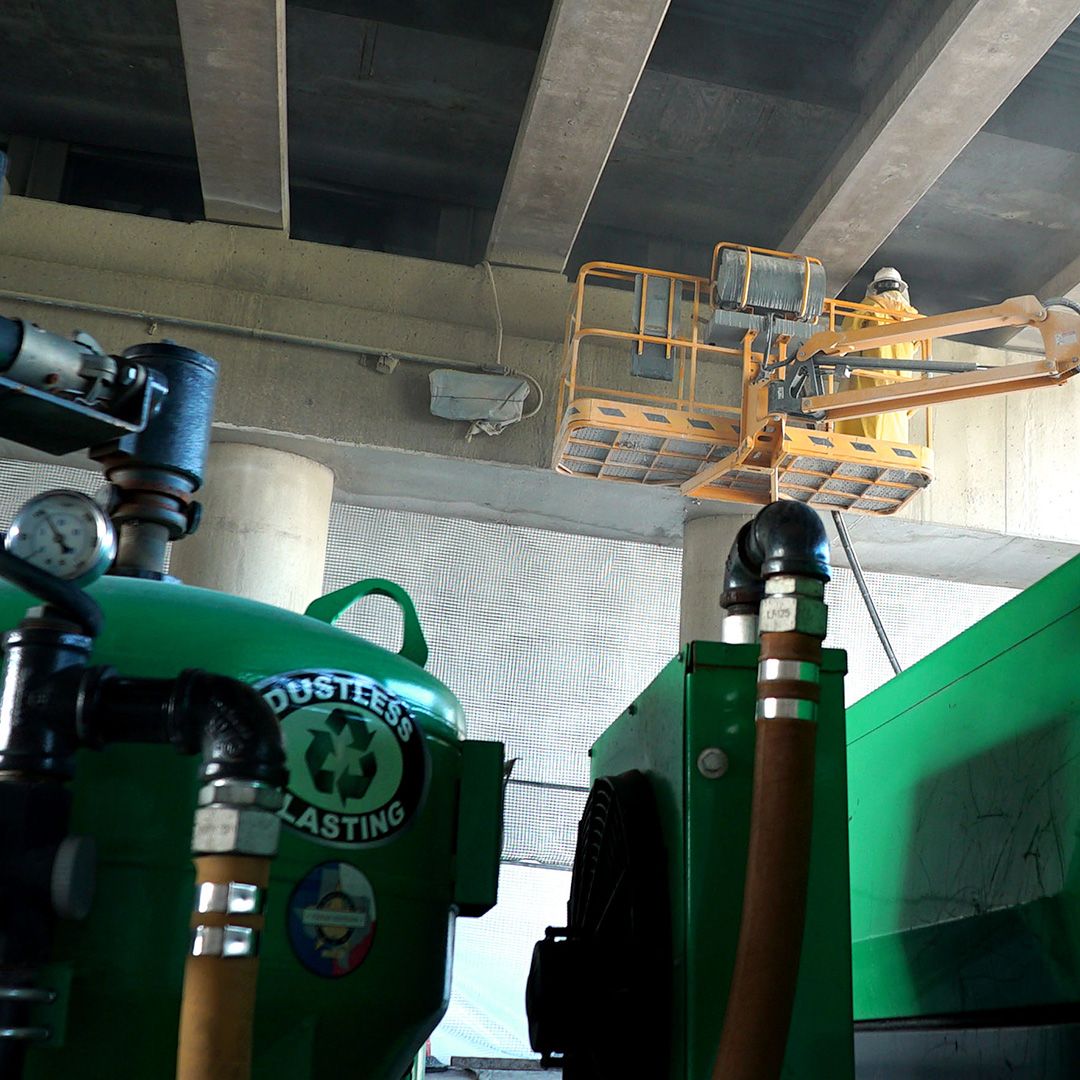 A green container with the word duster on it