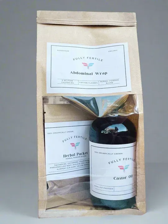 Package with abdominal wrap, herbal poultice, and castor oil bottle.