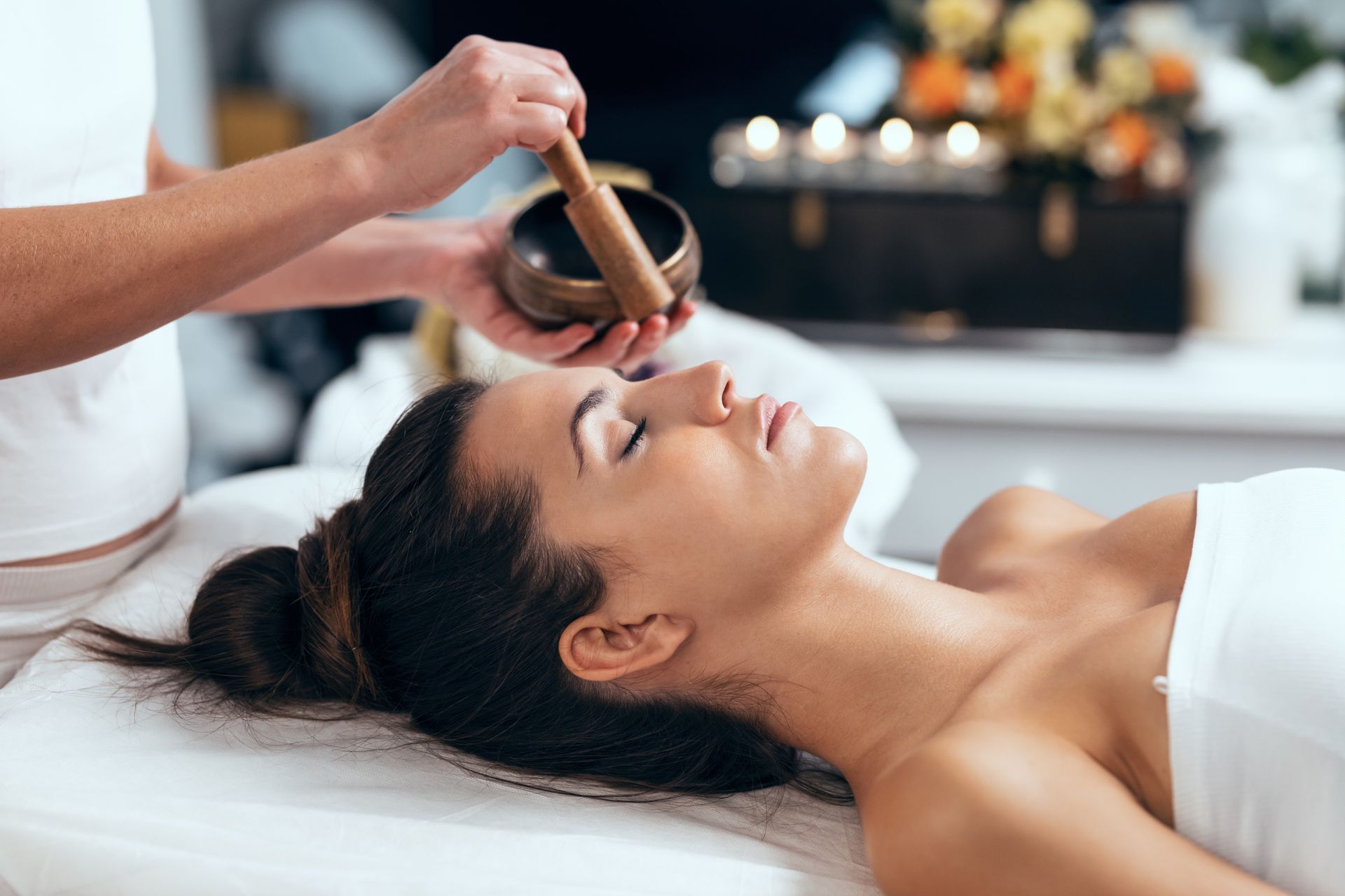 A woman is receiving traditional Chinese medicine techniques for fertility 