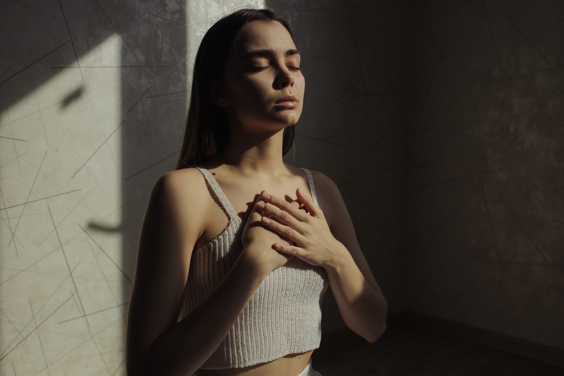 Woman deep breathing to deal with stress. 