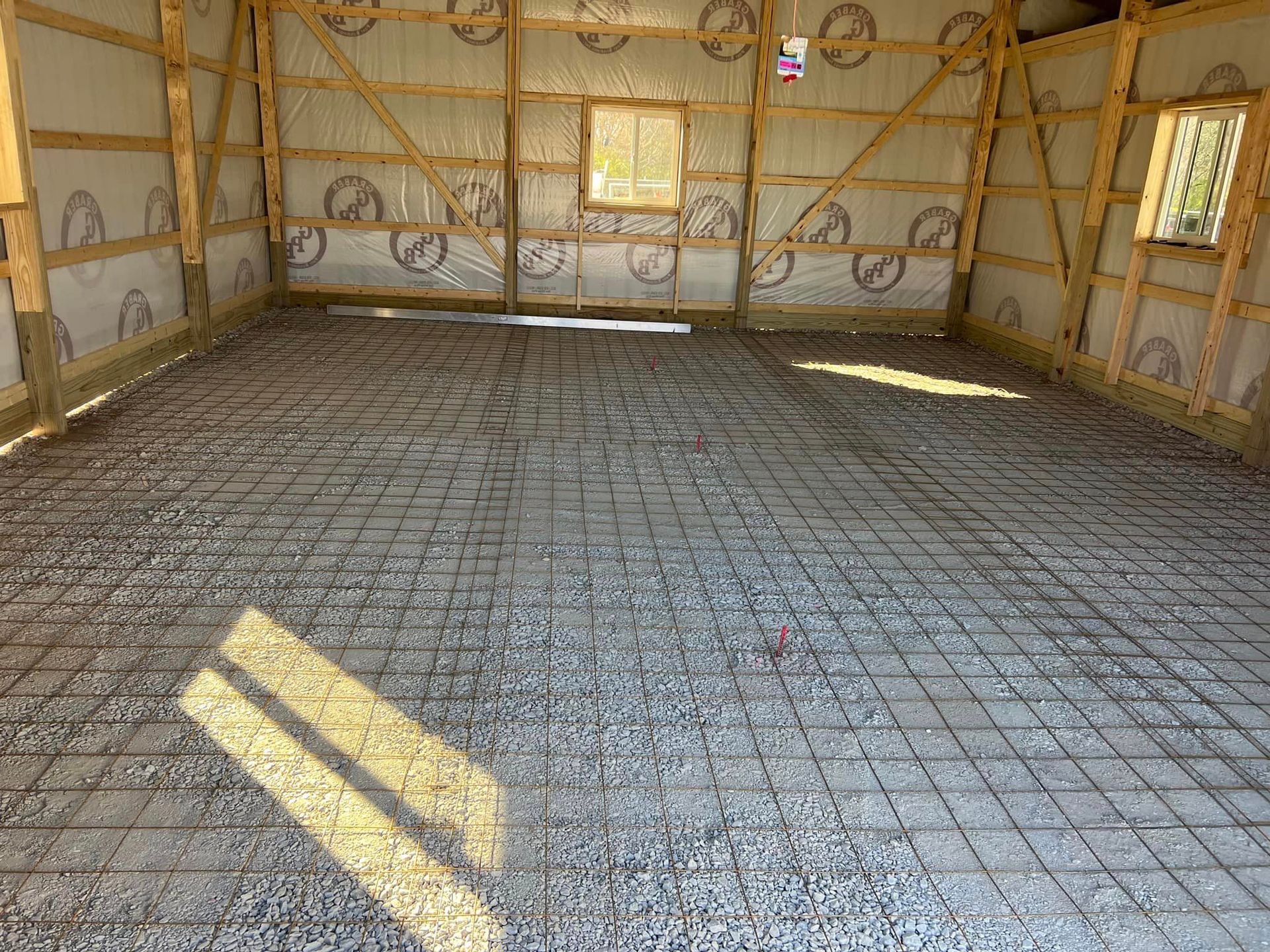 The inside of a building with a concrete floor and walls.