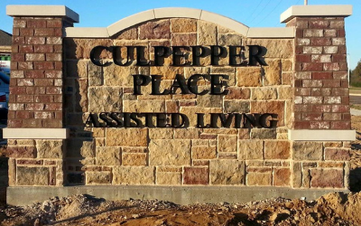 A stone monument sign reading 