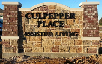 A stone monument sign reading