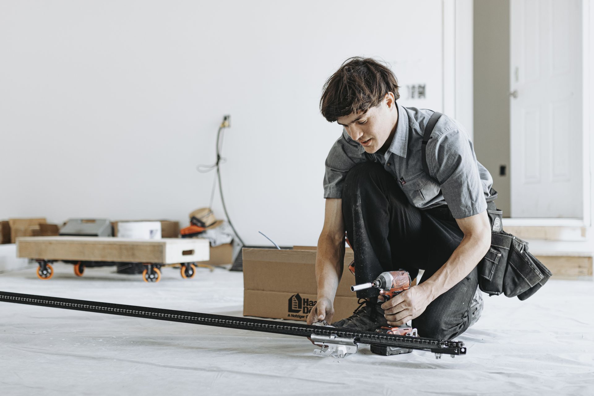 Person installing garage door
