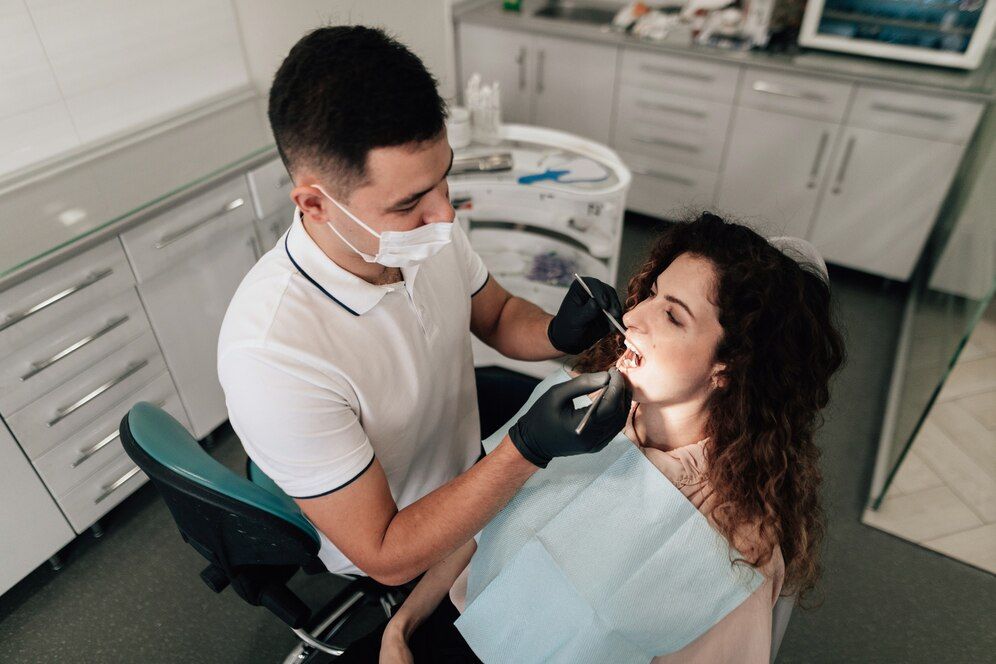 Young women undergoing dental filling.