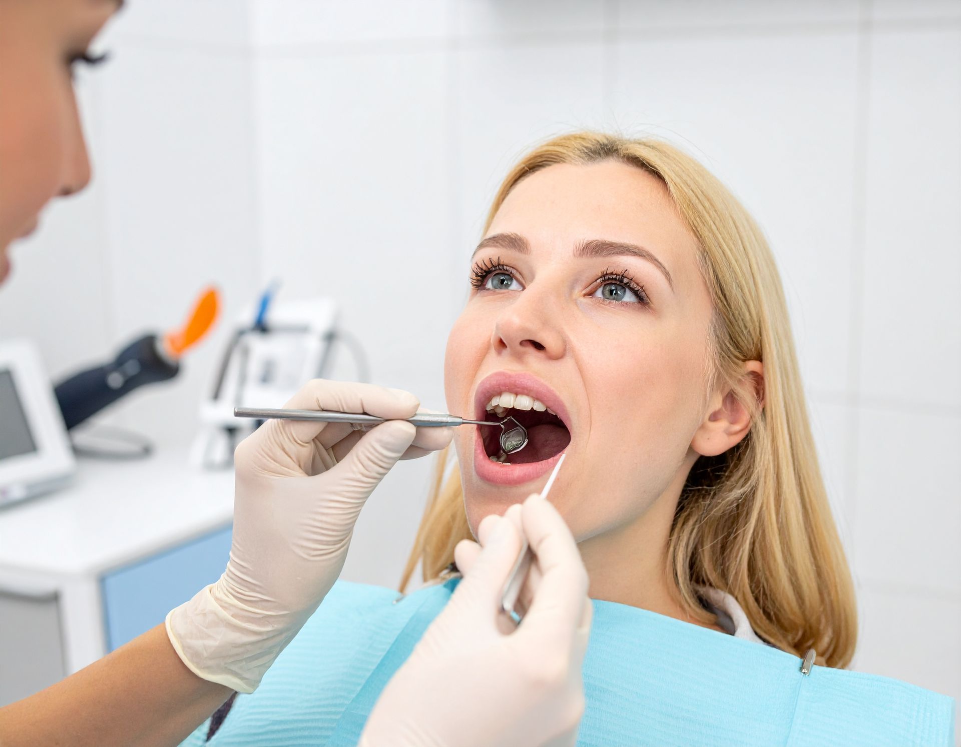Dentist Checking Teeth Before Root Canal Procedure