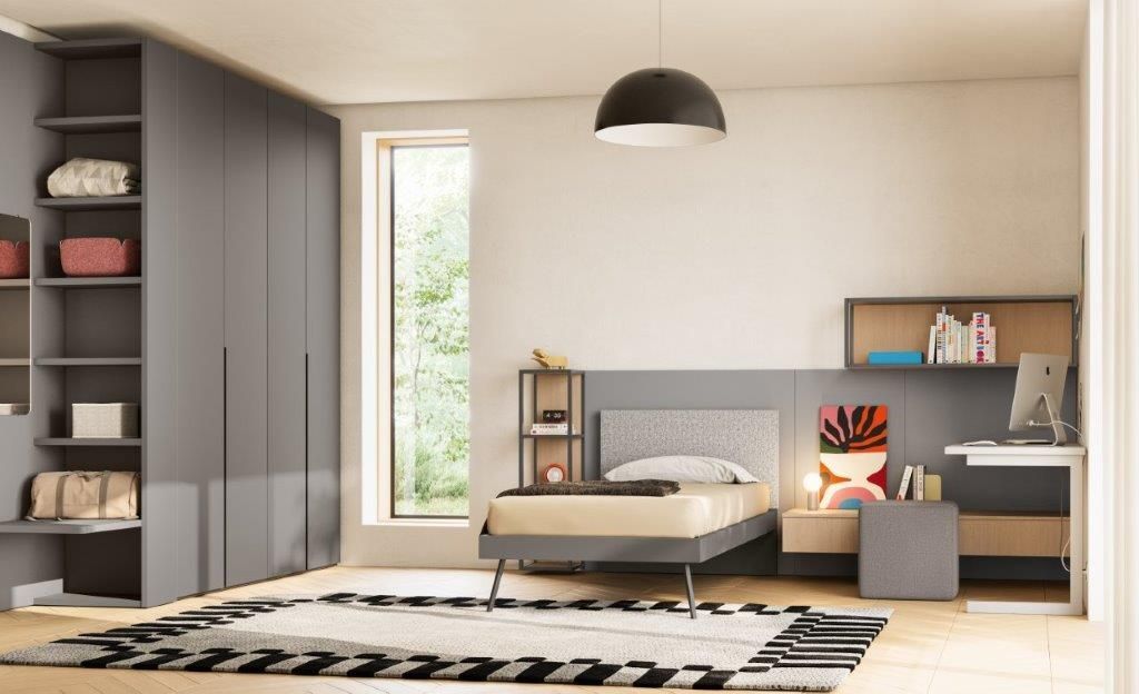 Camera da letto moderna con mobili grigi e un letto singolo.