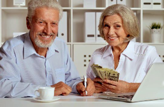 Old Couple Holding Money — Santa Cruz, CA — Dan Casagrande - Reverse Mortgages