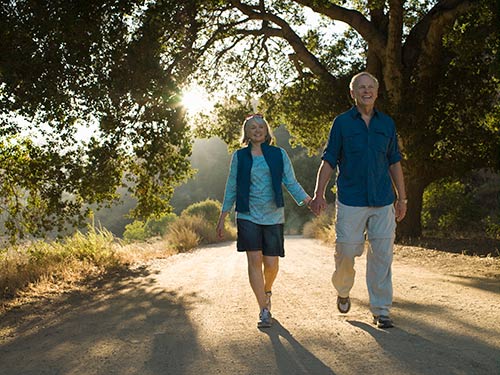 Happy Couple Walking — Santa Cruz, CA — Dan Casagrande - Reverse Mortgages