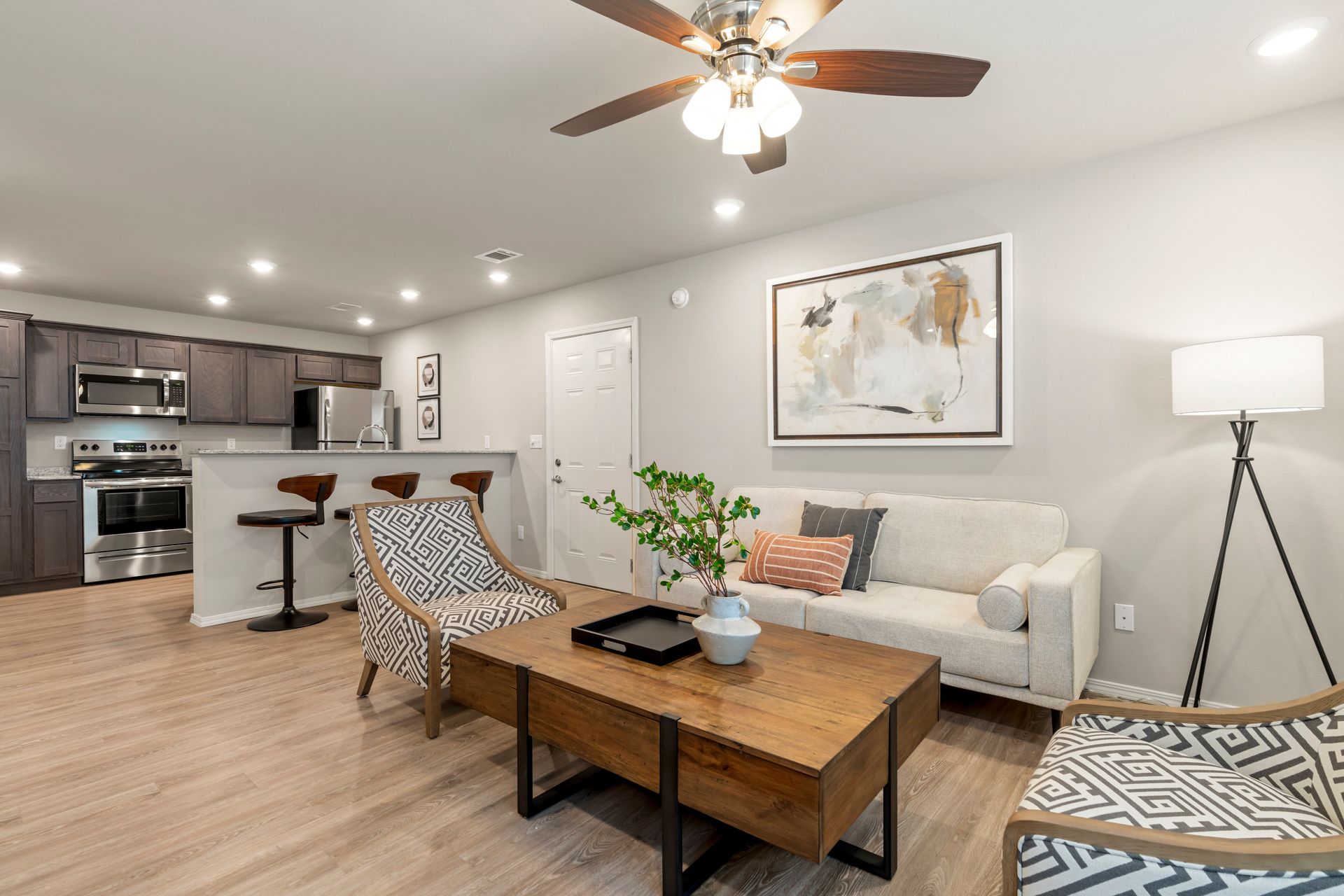 The Reserve at Springdale-furnished living room with celling fan and sofa
