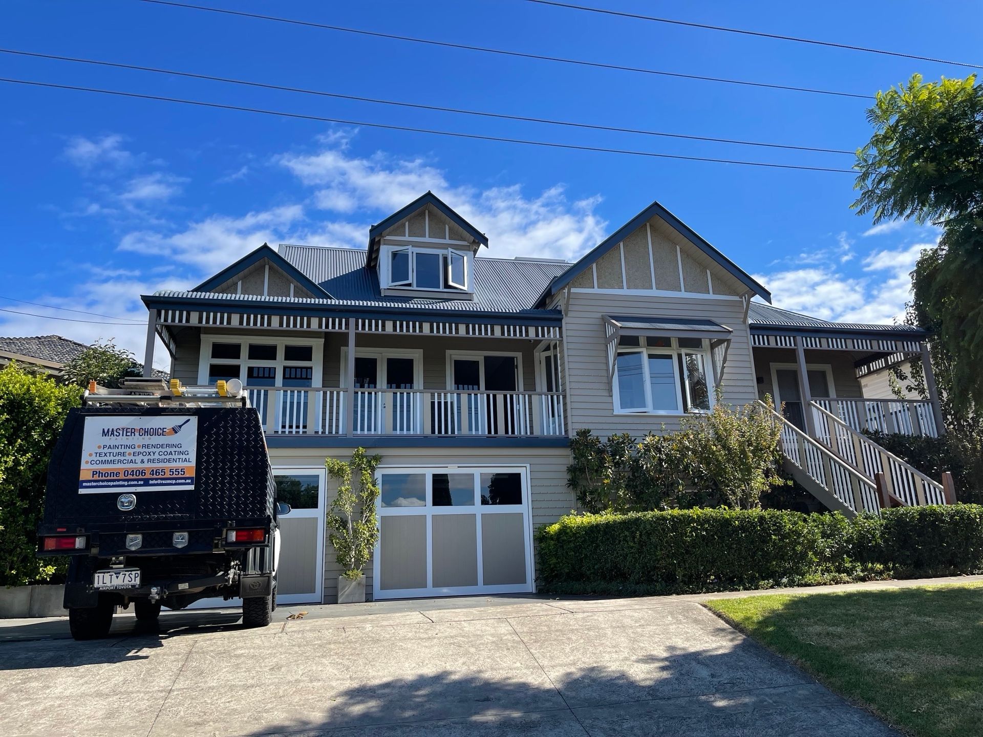 A large house with a truck parked in front of it