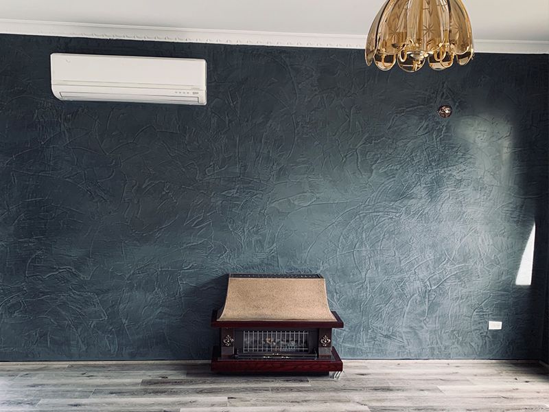 There is a fireplace in the middle of the room.