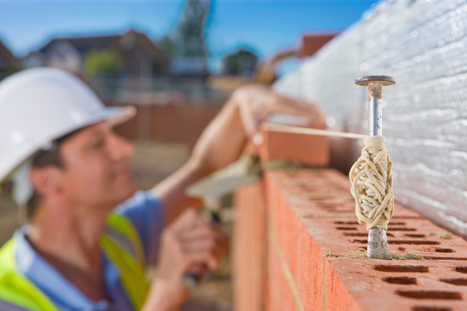 bricklayer building wall