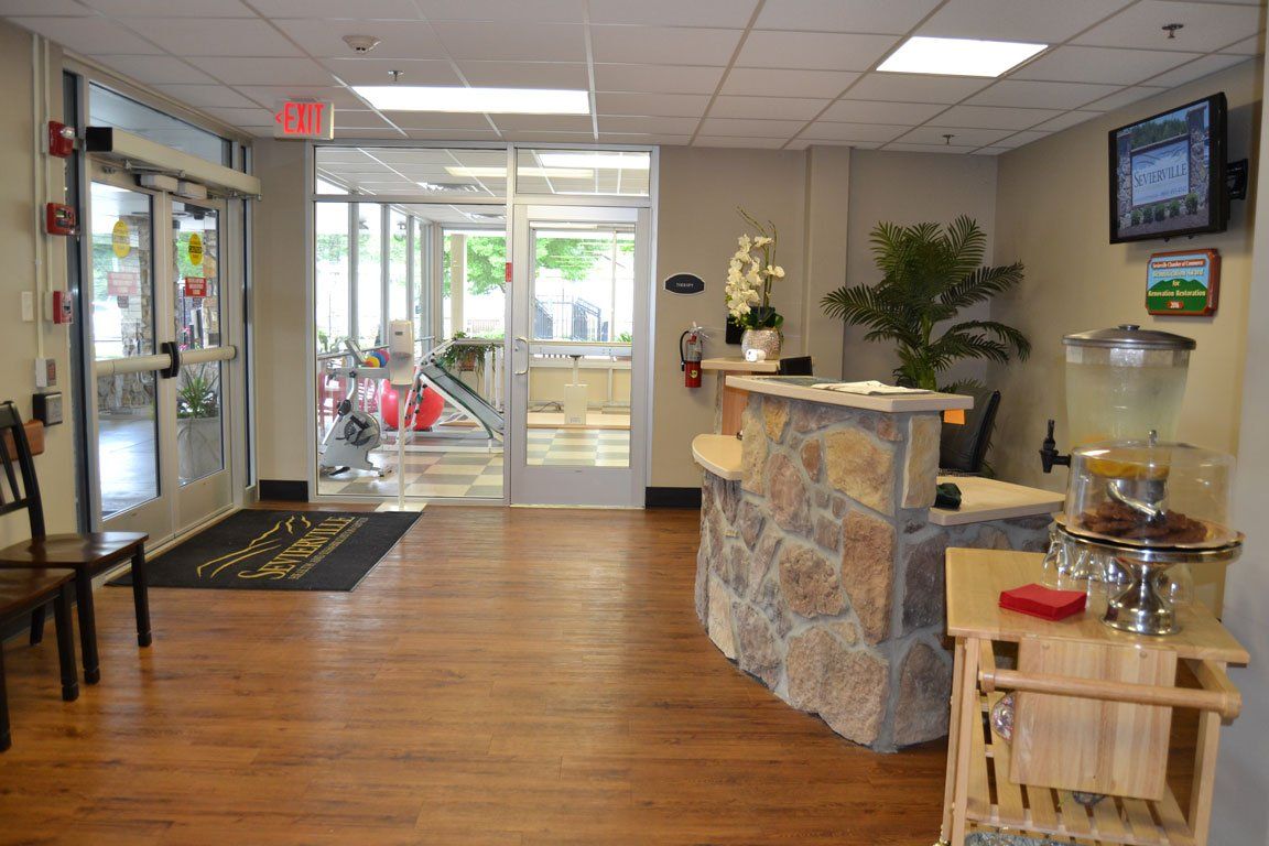 A large room with a stone counter in the middle of it.