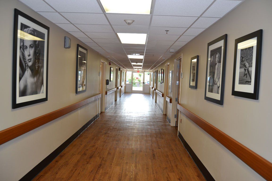 A long hallway with a lot of pictures on the wall