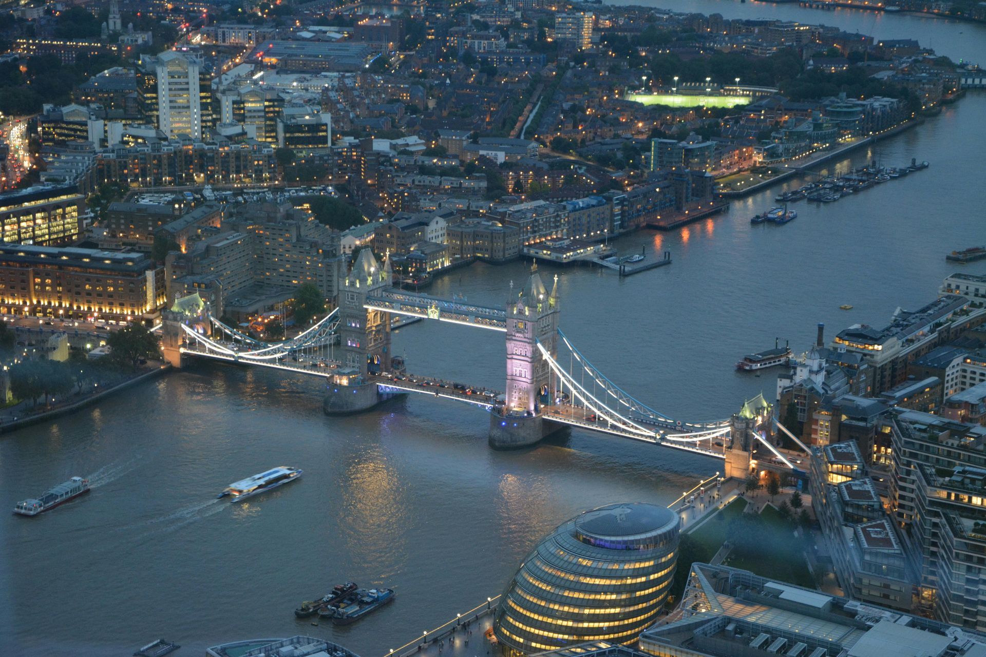 An aerial view of the tower bridge in london at night
