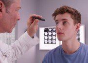 athlete or student being examined by doctor - physical