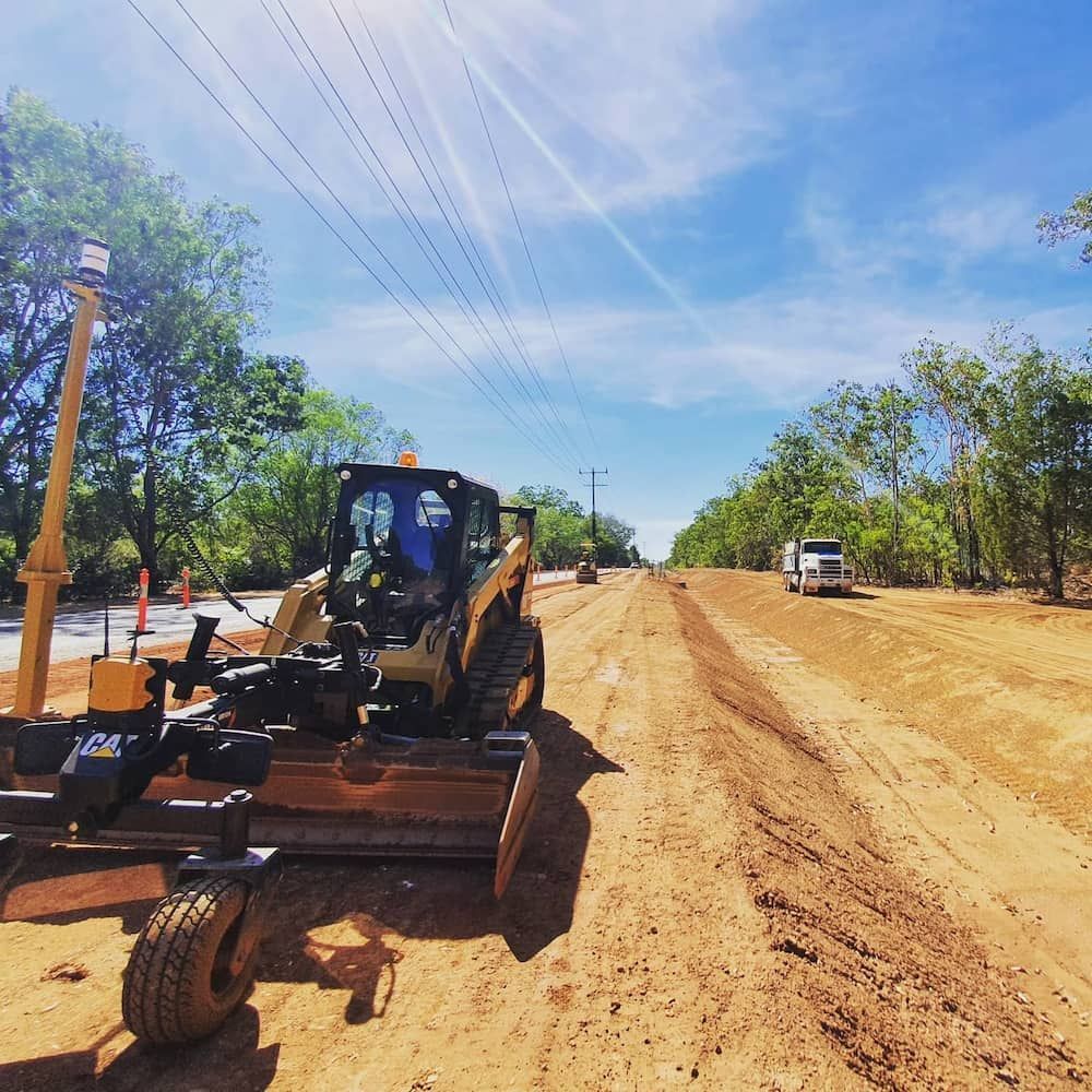 A Bulldozer is Working on a Dirt Road — Diggamen Civil Contracting in Tivendale, NT