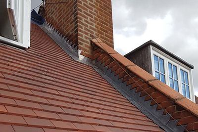 Newly flashed chimney with lead flashing installed by M&C Roofing & Building in Bicester.