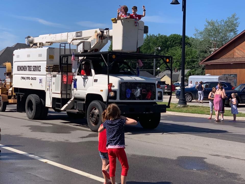 A white truck with the word utility on the side