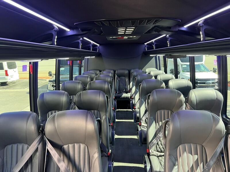 The inside of a bus with a lot of seats