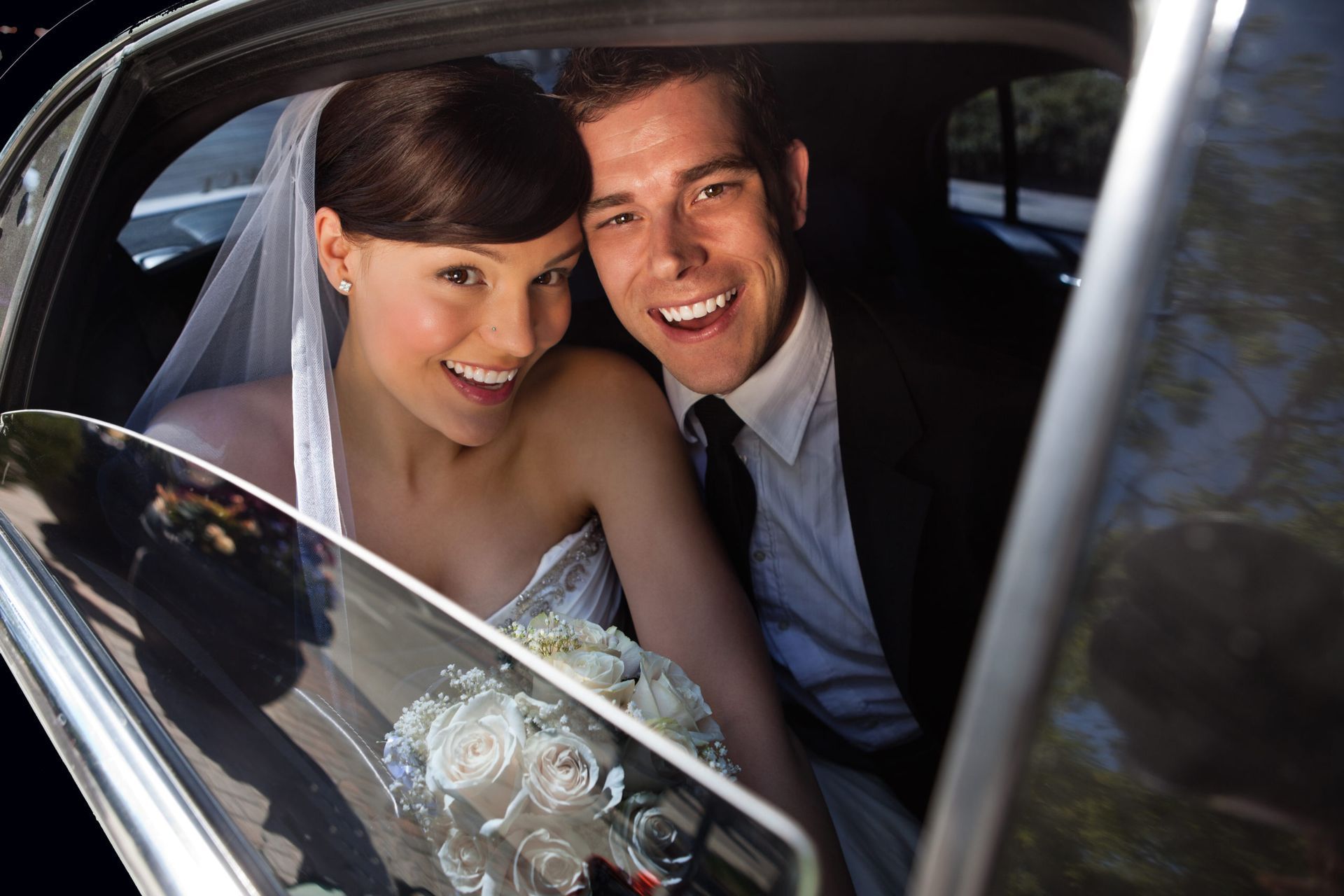 Bride and groom inside Houston wedding limo