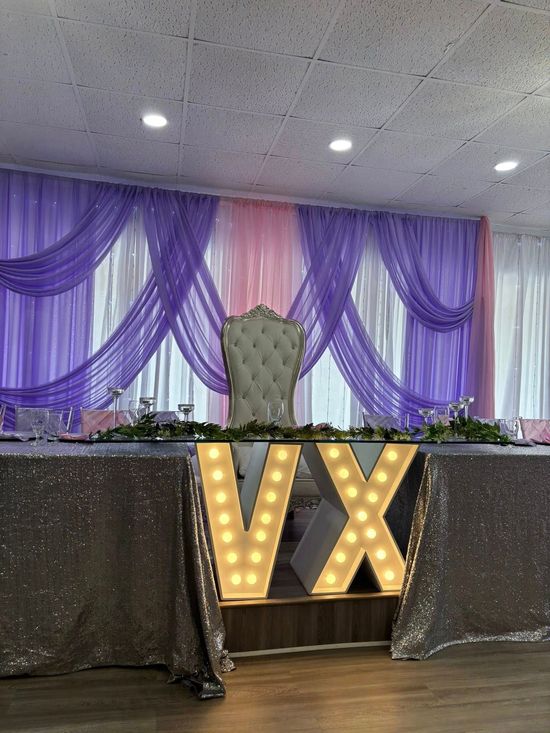 A table with a chair and a sign that says vx on it